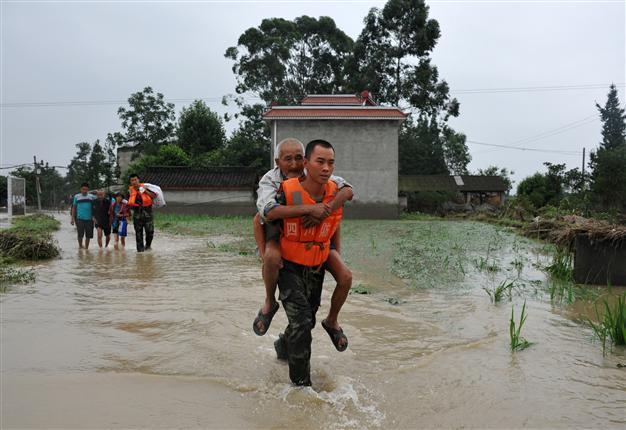 More than 200 dead or missing in China rain, landslides