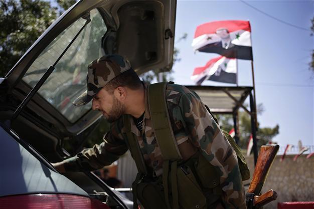 Syria evacuates most army buildings in Damascus: Residents