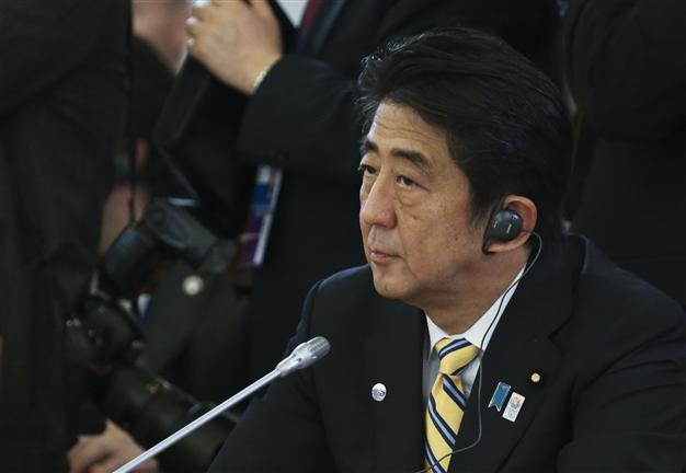Japan PM urges reset in ties at first meet with Chinas Xi