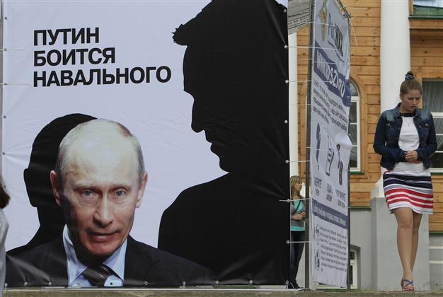 Russia pursues vandalism charges over offensive anti-Putin graffiti