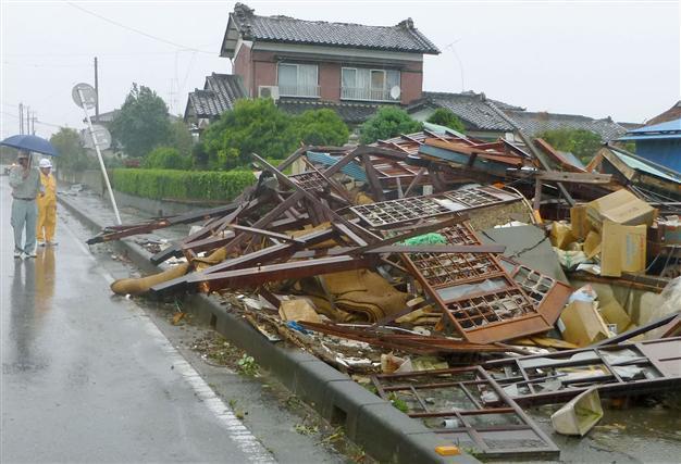 Japan tells 300,000 households to evacuate as typhoon hits