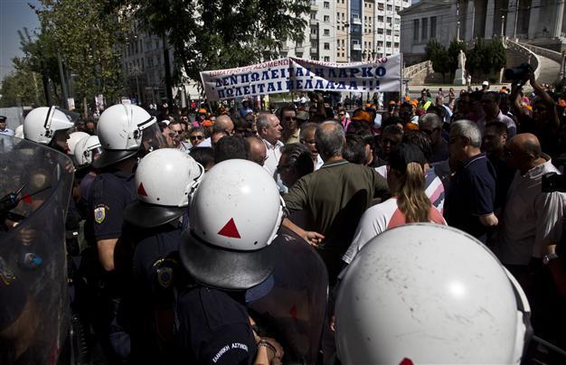 Greek police scuffle with school guards, teachers kick off strike