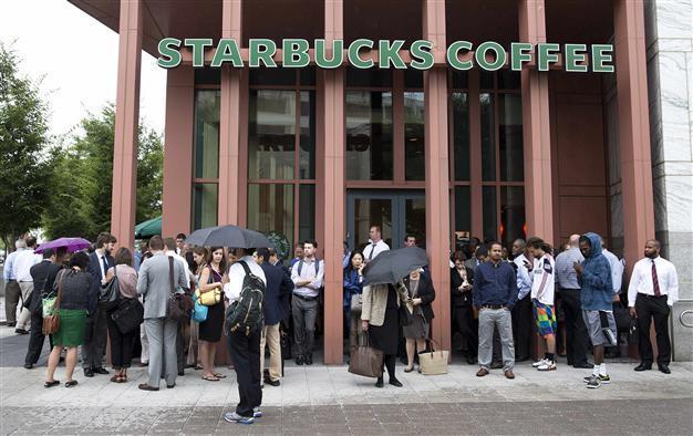 Starbucks says guns unwelcome, though not banned