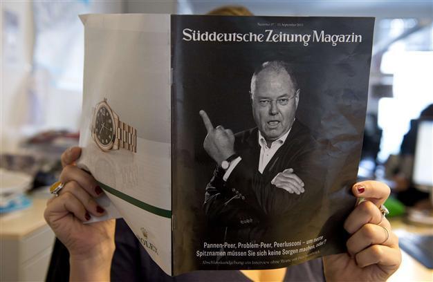 Merkel rival stirs online storm with middle-finger photo