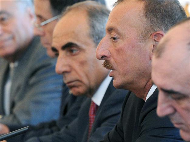Azeri journalist, critic of President Aliyev arrested before election
