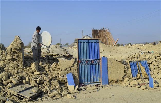 At least 12 dead after 6.8 magnitude quake hits shattered Pakistan region