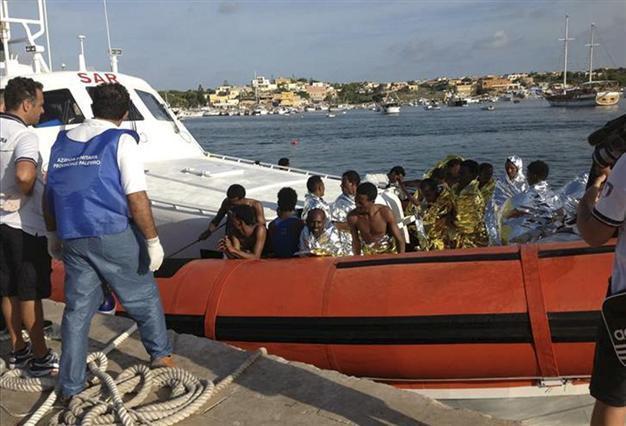 Scores dead in migrant boat disaster off Italy
