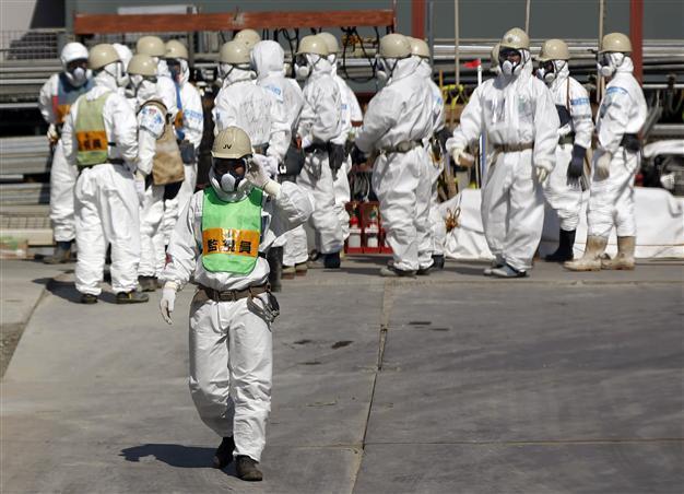 Six Fukushima workers doused with radioactive water