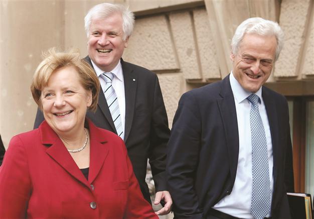 Merkel and defeated rivals set to seek grand coalition