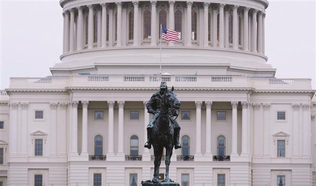 Fitch warns it may cut US rating from AAA