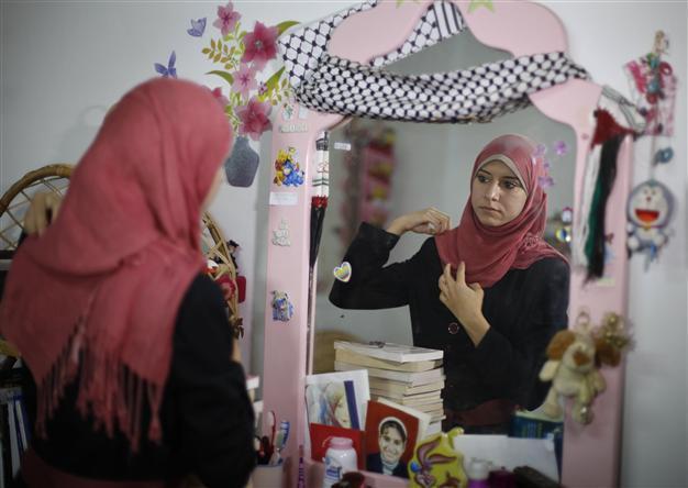 British-educated woman speaks for Hamas government in Gaza