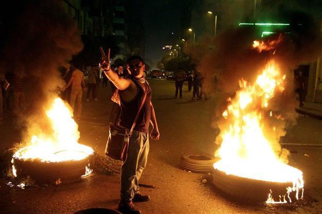 Egypt widens crackdown as two top activists ordered arrested