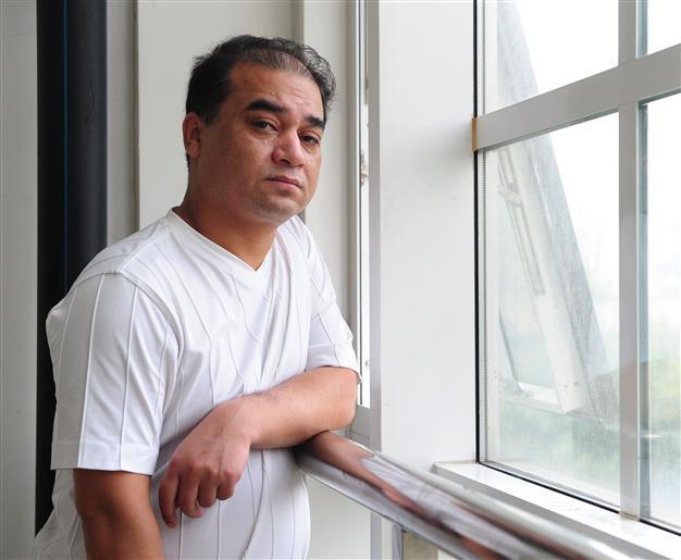 China detains prominent Uighur scholar for breaking law