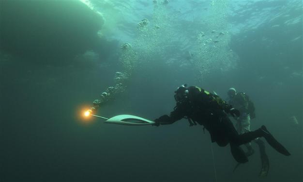 Olympic flame plunges into Russias lake Baikal