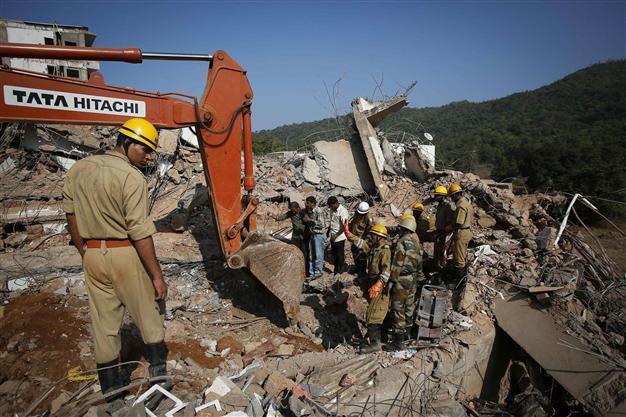 Rescuers race to find 20 still trapped in India building collapse
