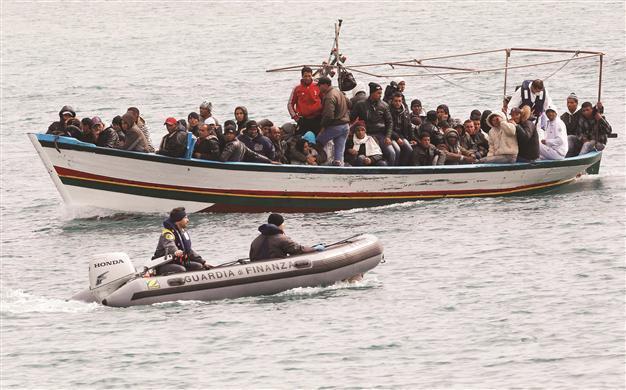 Video of migrants sprayed for scabies stirs outrage in Italy
