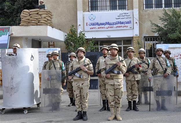 Egypt votes on new constitution as army chief eyes presidency