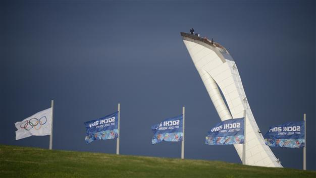 Olympic torch in Sochi amid protests over anti-gay law