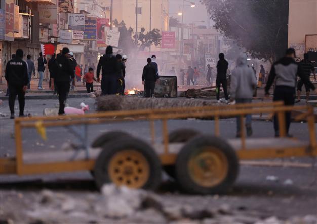 Bahrain protesters clash with police on uprising anniversary