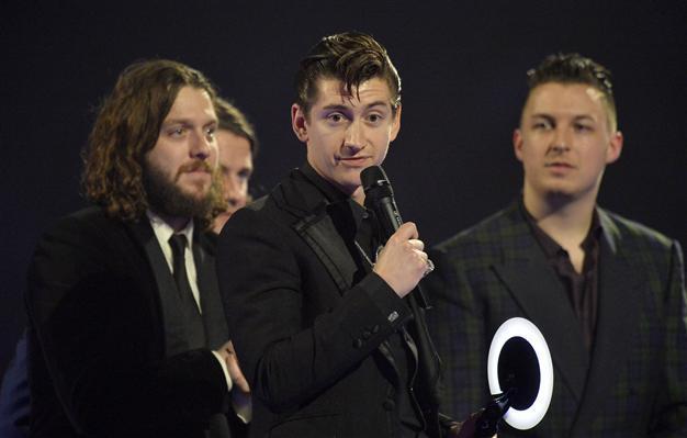 Bowie becomes oldest Brit winner, but Arctic Monkeys steal show