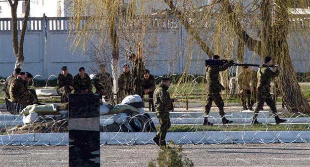 Russian troops seize Ukraine marine base in Crimea