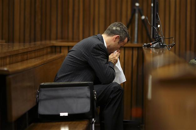 Pistorius vomits in court as girlfriends autopsy detailed