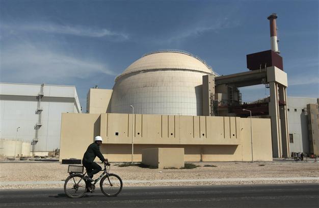 Iran curbs enrichment as nuclear deal takes effect