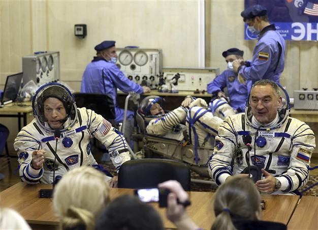 NASA suspends Russia ties, except on space station