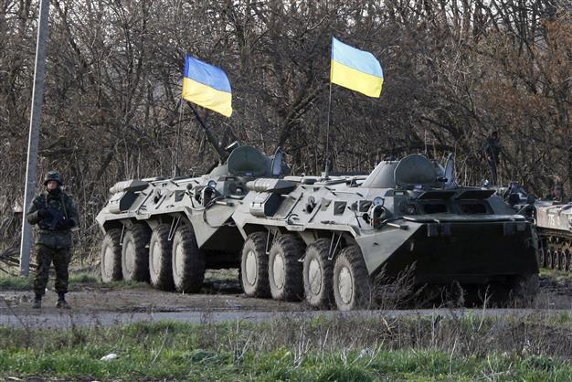 Putin warns Ukraine on brink of civil war as Kiev sends army in eastern town