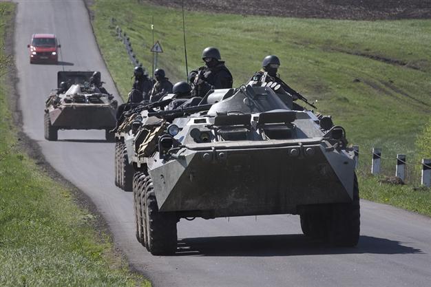 G7 agrees sanctions on Russia, as Ukraine rebels detain OSCE team