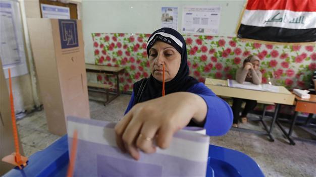 Iraqis vote on Wednesday as blast at polling centre kills two women