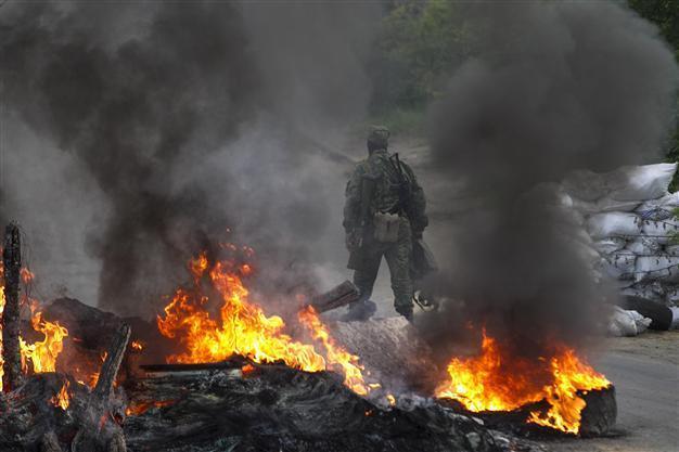More than 30 die in ’criminal’ blaze in Ukraine, as rebels down three army helicopters