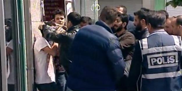 Police force young man to pose with kefiyyeh during May Day protests