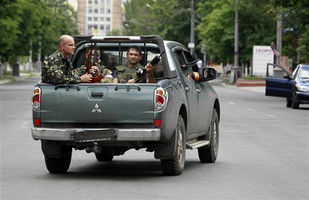 Ukrainian forces reclaim port city from rebels