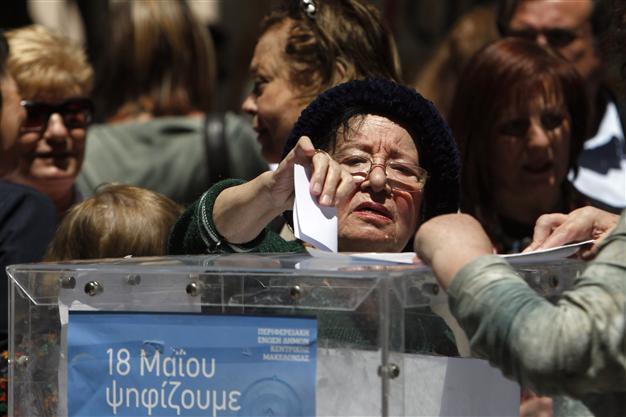 Close race in Greek local elections between leftists, government