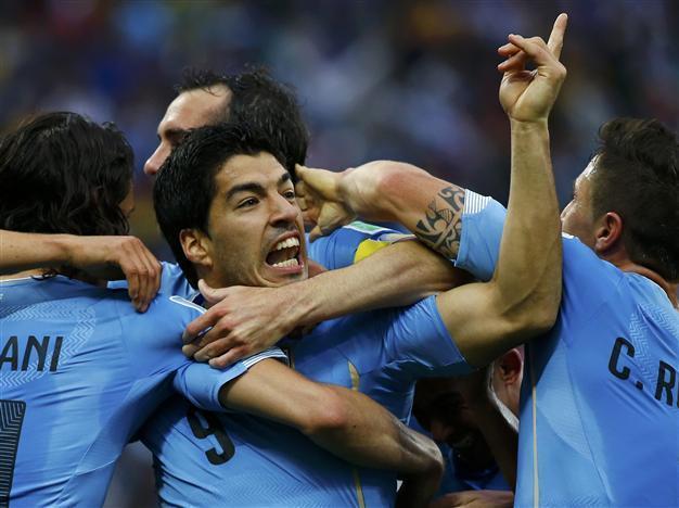 Suarez double shatters England as Uruguay win