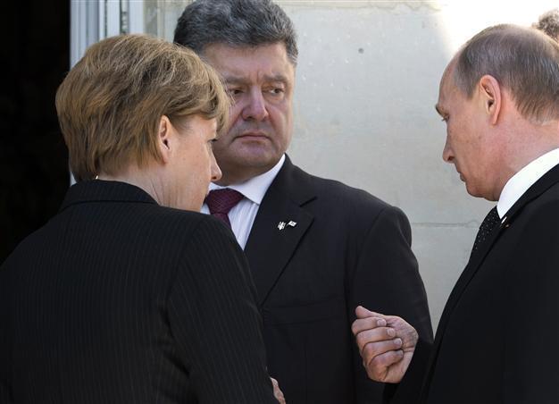 Putin meets Ukraine president-elect before D-Day lunch