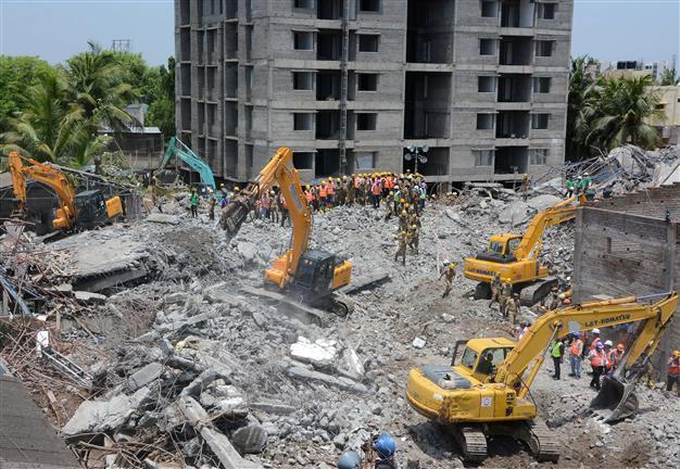 Survivors pulled from collapsed India building, toll hits 20