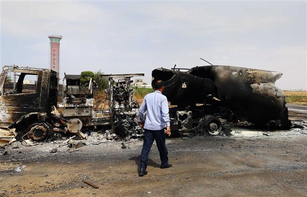 UN pulls staff out of Libya as clashes kill at least 13, close airports