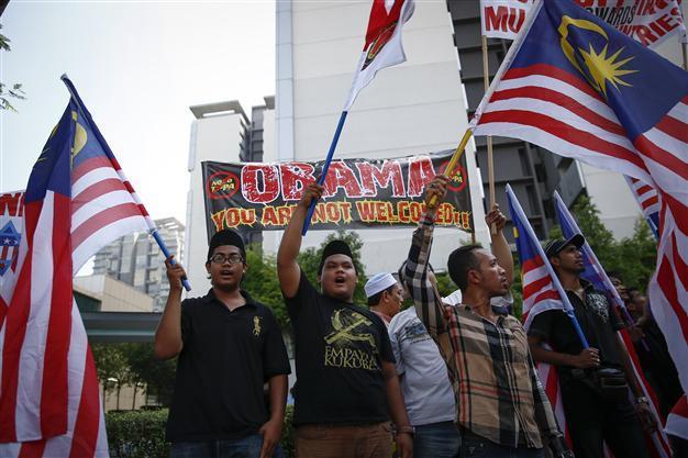 Malaysia vows MH370 transparency as families vent anger