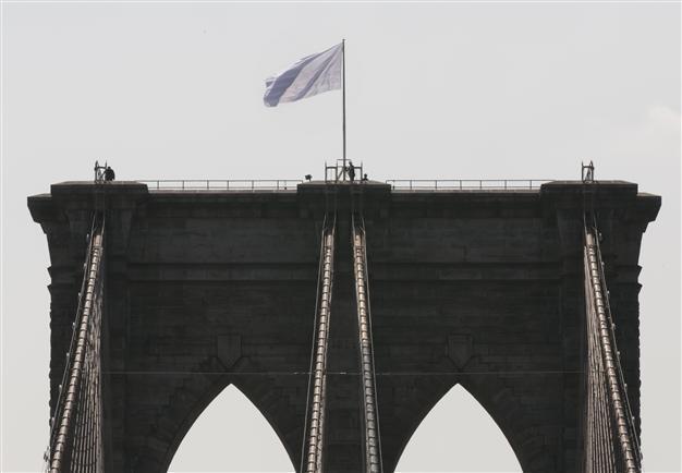 Two German artists claim Brooklyn Bridge flag stunt