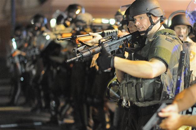 Obama orders review of US police use of military hardware