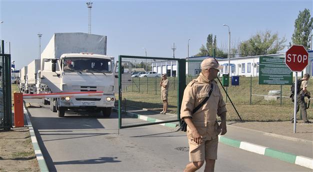 Kyiv says battling armour from Russia as Moscow plans new convoy