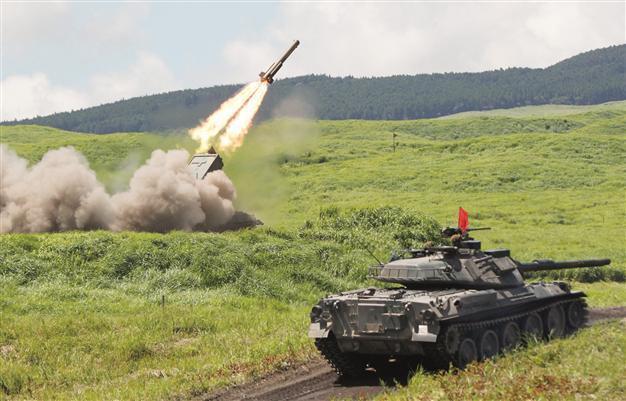 Japan defense planners seek spending boost amid rivalry