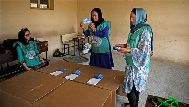 Afghan election workers among 11 killed by roadside bomb