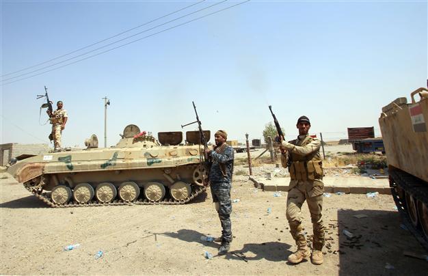 Iraqi forces press advance as parliament stormed