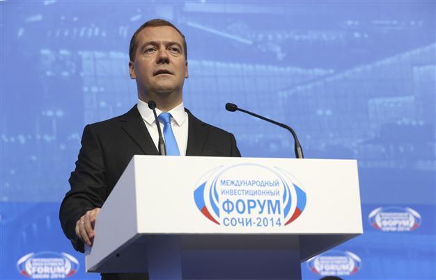 Russian PM Medvedev vows to keep economy open, hails pivot to China