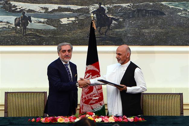Afghanistans presidential rivals sign pact for power-sharing government