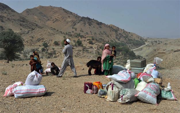 Up to 100 Afghans killed, 12 beheaded, in Taliban offensive