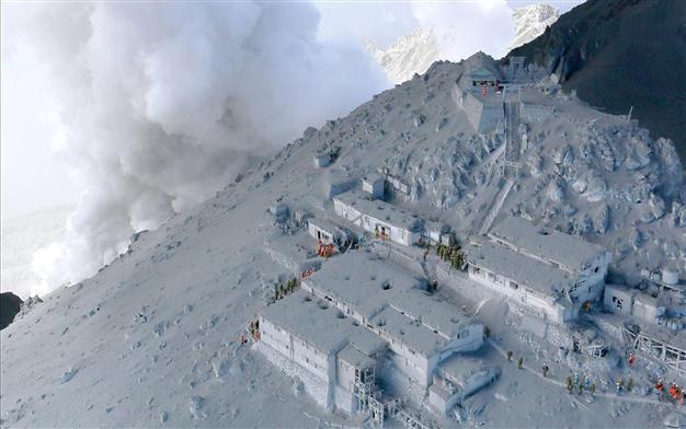 At least 31 feared dead near peak of Japanese volcano
